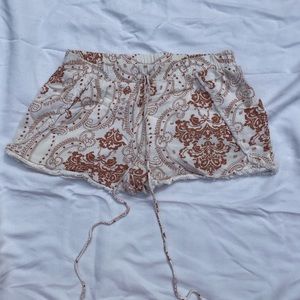 White/cream and tan patterned shorts